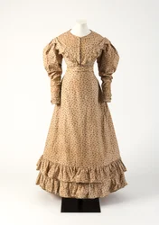Brown, and pink, yellow, and green roller-printed cotton dress, 1825